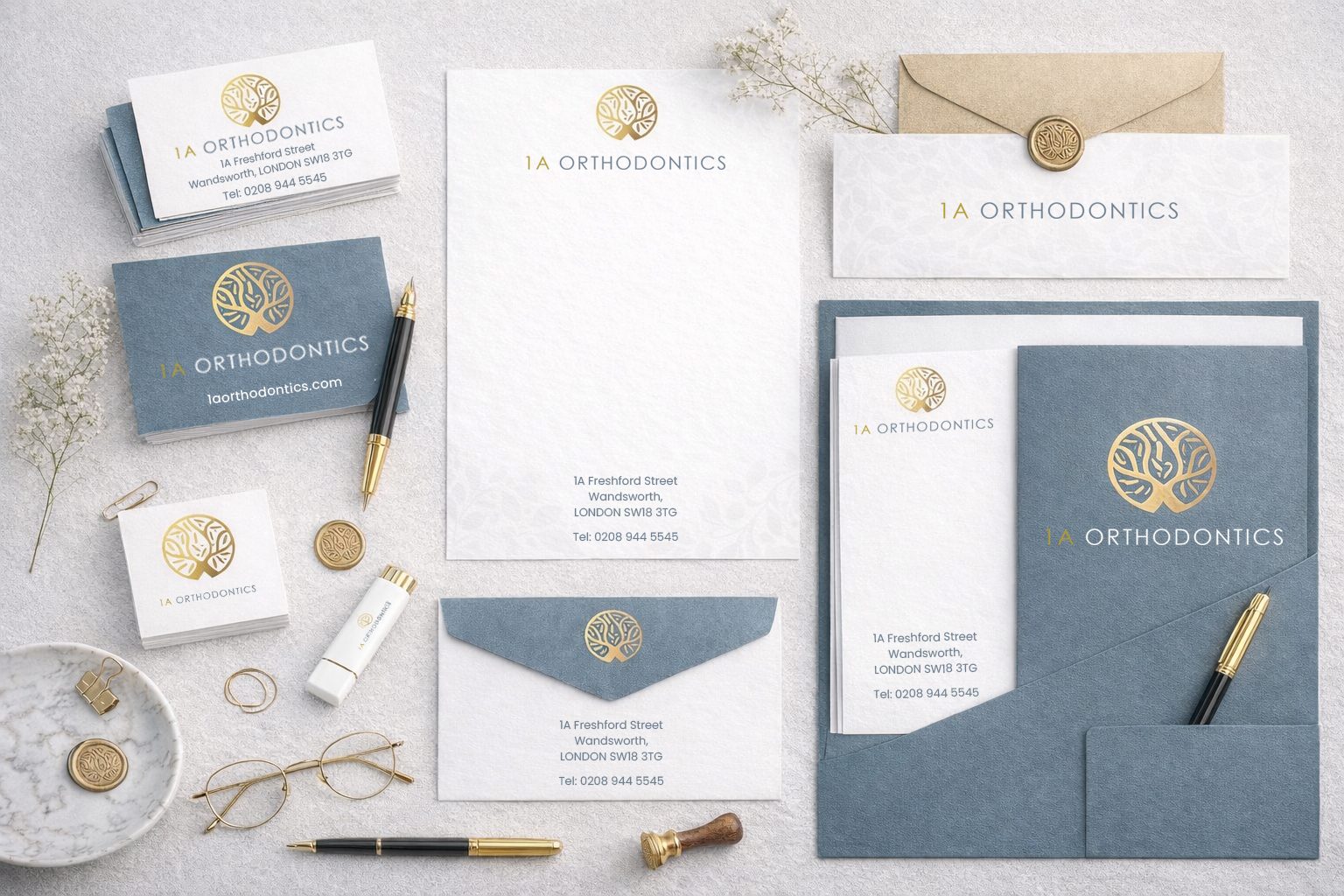 1A Orthodontics full stationery flat-lay — business cards, letterheads, envelopes, folders and wax seals
