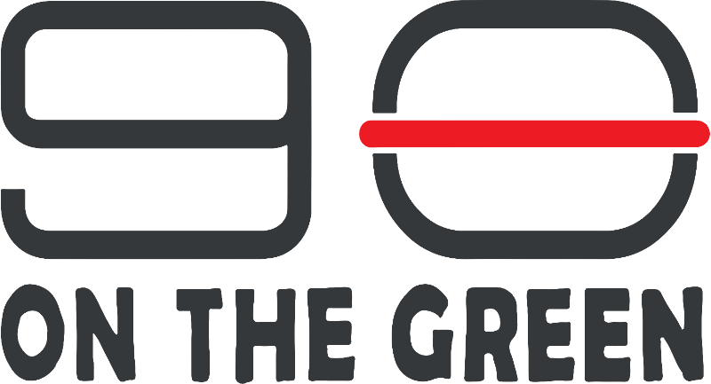 90 On The Green primary mark — charcoal '9' and '0' as stylised burger buns with a poppy-red patty line between them, ON THE GREEN wordmark below