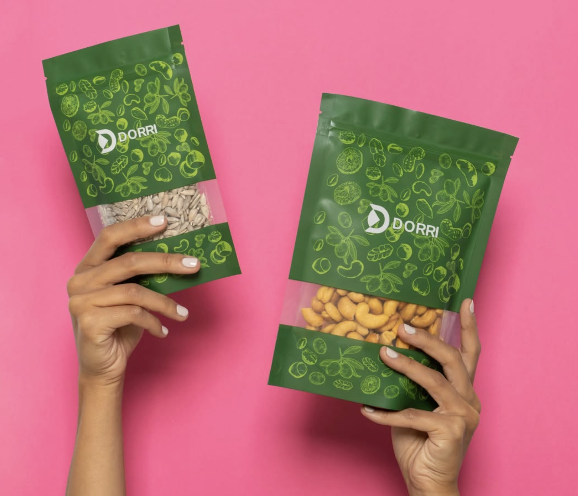 Two Dorri botanical pouches (sunflower seeds and cashews) held up against a hot-pink background